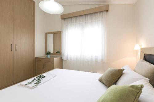 Postel nebo postele na pokoji v ubytování Olive Tree Apartments