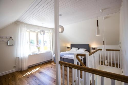 a bedroom with a bed and a window at Haapsalu Old Town Apartments in Haapsalu