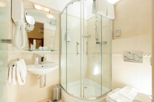 a bathroom with a shower and a sink at Royal Suites in Split