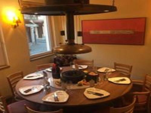 a dining room table with food on top of it at Hotel Concordia in Porlezza
