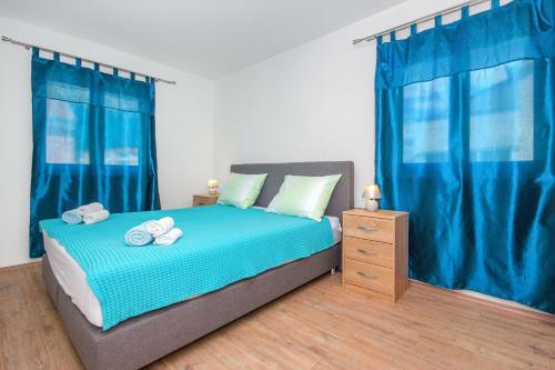 Ένα ή περισσότερα κρεβάτια σε δωμάτιο στο Radic apartments