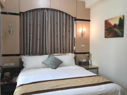 Postel nebo postele na pokoji v ubytování Lucky Bear Guesthouse