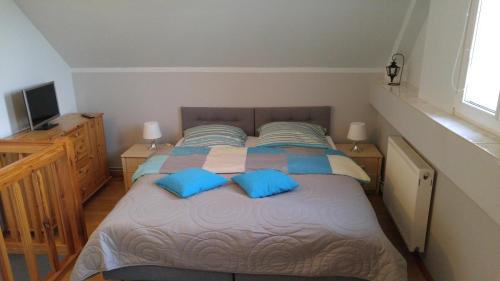 Una cama o camas en una habitación de apartamenty na skarpie