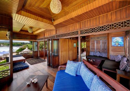a living room with a couch and a table at Jasri Bay Hideaway in Jasri