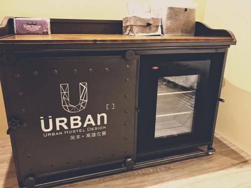 a black fireplace with a wooden counter on top at Urban in Kaohsiung