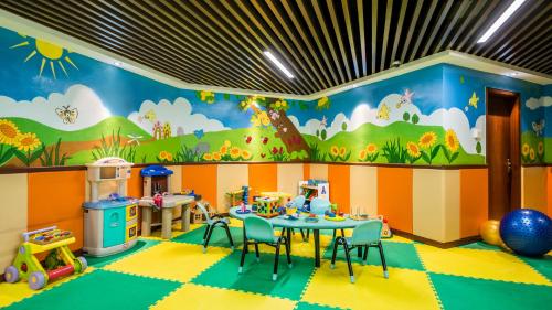 a childs play room with a table and chairs at Springdale Serviced Residence Guangzhou in Guangzhou