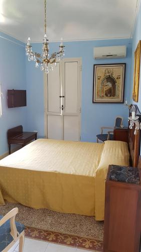Кровать или кровати в номере Casette di Artemide