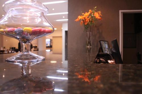 a glass wine glass filled with candy on a table at Destino Real Hotel in Buenos Aires