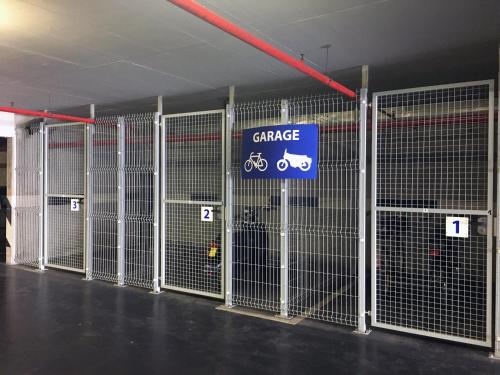 a gate in a parking garage with a sign on it at Perla, Resort & Entertainment in Nova Gorica