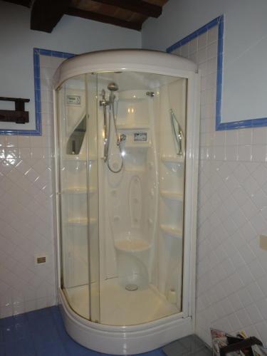 a shower in a bathroom with a glass door at B&B Fonte Dei Billi in Pennabilli