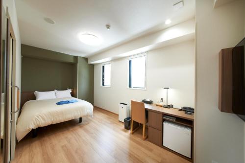 Krevet ili kreveti u jedinici u okviru objekta Hotel Sun Clover Koshigaya Eki mae