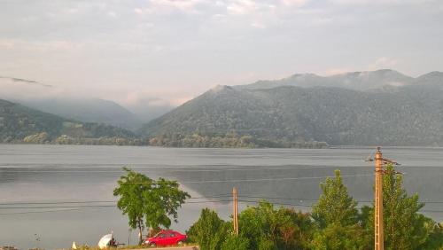a view of a large body of water with mountains at Villa Rustica in Gornea