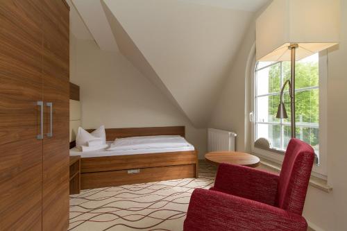Postel nebo postele na pokoji v ubytování HOTEL am STRAND