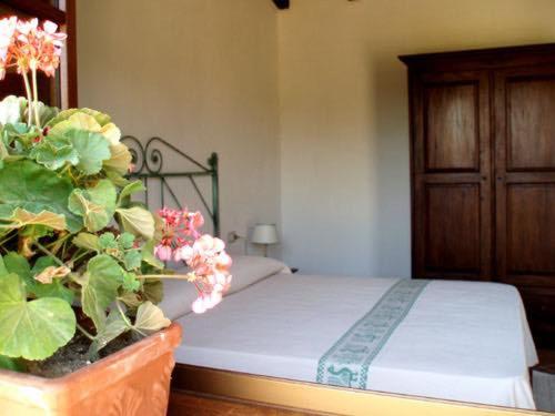 En eller flere senger på et rom på Agriturismo La tanca