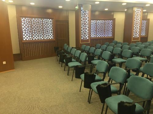 a room with rows of chairs in a room at Ayder Hasimoglu Hotel in Ayder Yaylasi