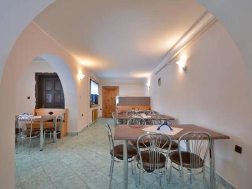 a group of tables and chairs in a room at Willa Maria in Kościelisko
