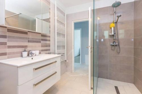 a bathroom with a sink and a shower at Apartment Laura in Kostrena