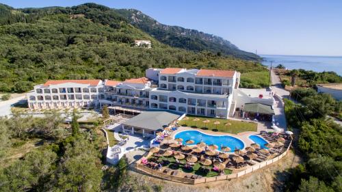 an aerial view of a resort with a swimming pool at Saint George Palace in Perlopsimades