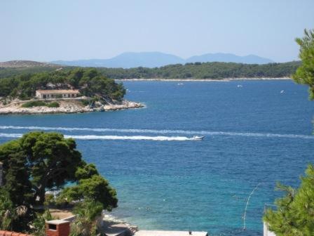a large body of water with a boat in it at Castle Štambuk in Hvar
