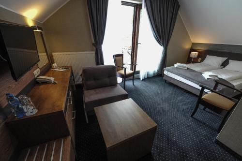 Ένα ή περισσότερα κρεβάτια σε δωμάτιο στο Hotel Rudnik