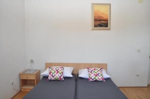Ένα ή περισσότερα κρεβάτια σε δωμάτιο στο Apartments Veselko