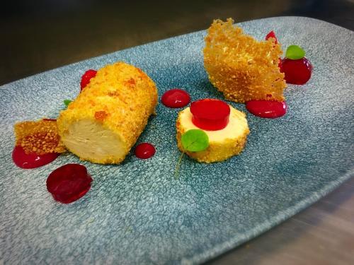a blue plate with three different types of food at The Bath Arms Hotel in Cheddar