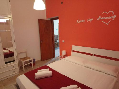 Katil atau katil-katil dalam bilik di I Colori degli Agrumi Holiday Home