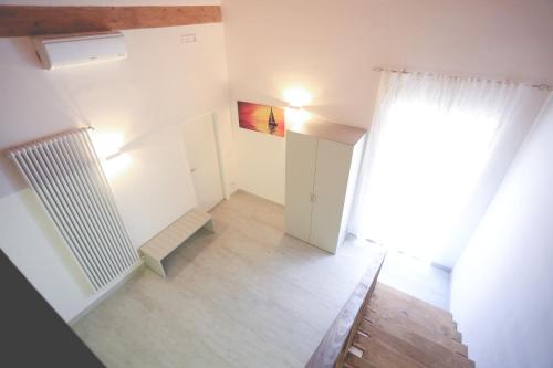 an empty room with a curtain and a window at IL VIAGGIATORE VIA INDIPENDENZA B&B in Gaeta