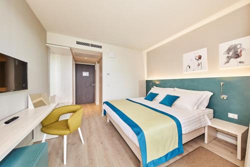 Postel nebo postele na pokoji v ubytování Hotel Sipar Plava Laguna