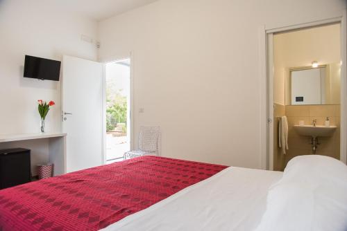Letto o letti in una camera di Blu Salentino b&b con Parcheggio Privato Gratuito