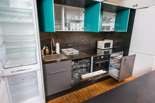 Kuchyň nebo kuchyňský kout v ubytování Appartements Ferchergasse