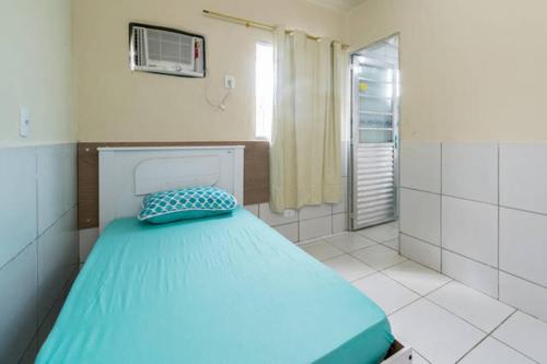 A bed or beds in a room at Temporada Casa em Condomínio na Ilha de Itamaracá