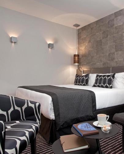 Postel nebo postele na pokoji v ubytování Le Grey Hotel
