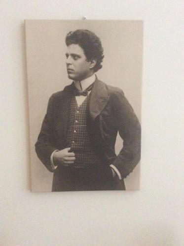 a black and white photo of a man in a suit and bow tie at B&B Notte sul Lago in Gozzano