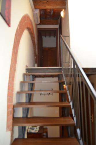 a set of stairs in a building with a door at Antico Borgo Casalappi in Campiglia Marittima