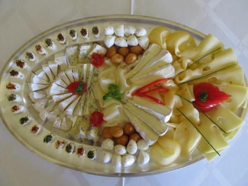 a plate of food with different foods on it at Hotel Růžek in Hranice