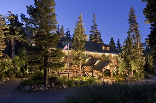 a large stone building with a large clock on top of it at Tamarack Lodge in Mammoth Lakes