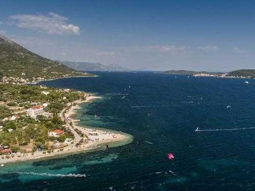 an aerial view of a beach and the ocean at Apartman Iva in Kučište