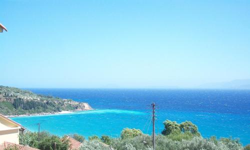 a view of a beach with blue water at Ramona in Lourdhata