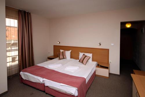 Postel nebo postele na pokoji v ubytování Hotel Briz