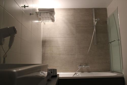 Koupelna v ubytování Hotel Astel