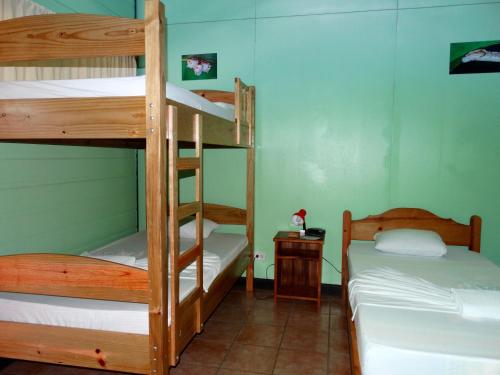 a room with two bunk beds in a room at La Selva Biological Station in Sarapiquí