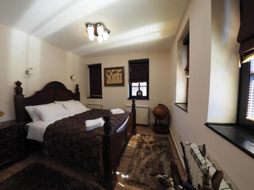 Ein Bett oder Betten in einem Zimmer der Unterkunft Guest house DON-lux