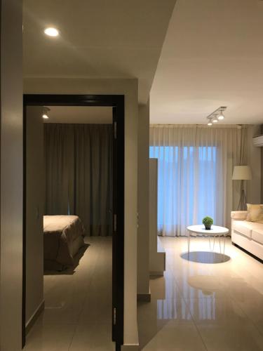 Ένα ή περισσότερα κρεβάτια σε δωμάτιο στο 9 de Julio Park Suites