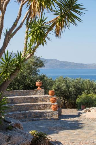 a set of stairs with a view of the ocean at Monemvasia Village (ex Topalti) in Monemvasia