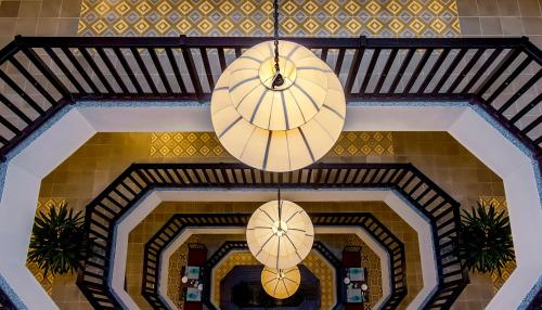 two lights hanging from a ceiling in a building at Lantana Riverside Hoi An Boutique Hotel & Spa in Hoi An