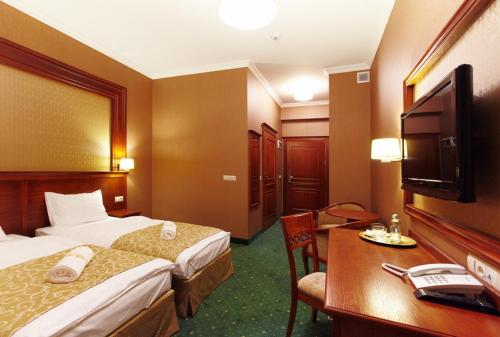 Katil atau katil-katil dalam bilik di Hotel Grodzki Business & Spa