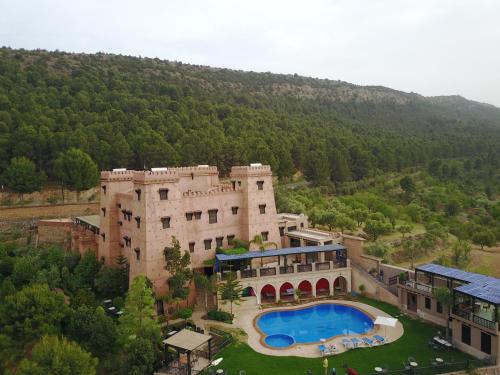 an aerial view of a building with a swimming pool at Kasbah Illy in Demnat
