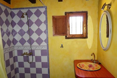 a bathroom with a sink and a shower at Casa del Pinar in Enciso