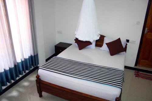 Łóżko lub łóżka w pokoju w obiekcie Adhi's Place Ella